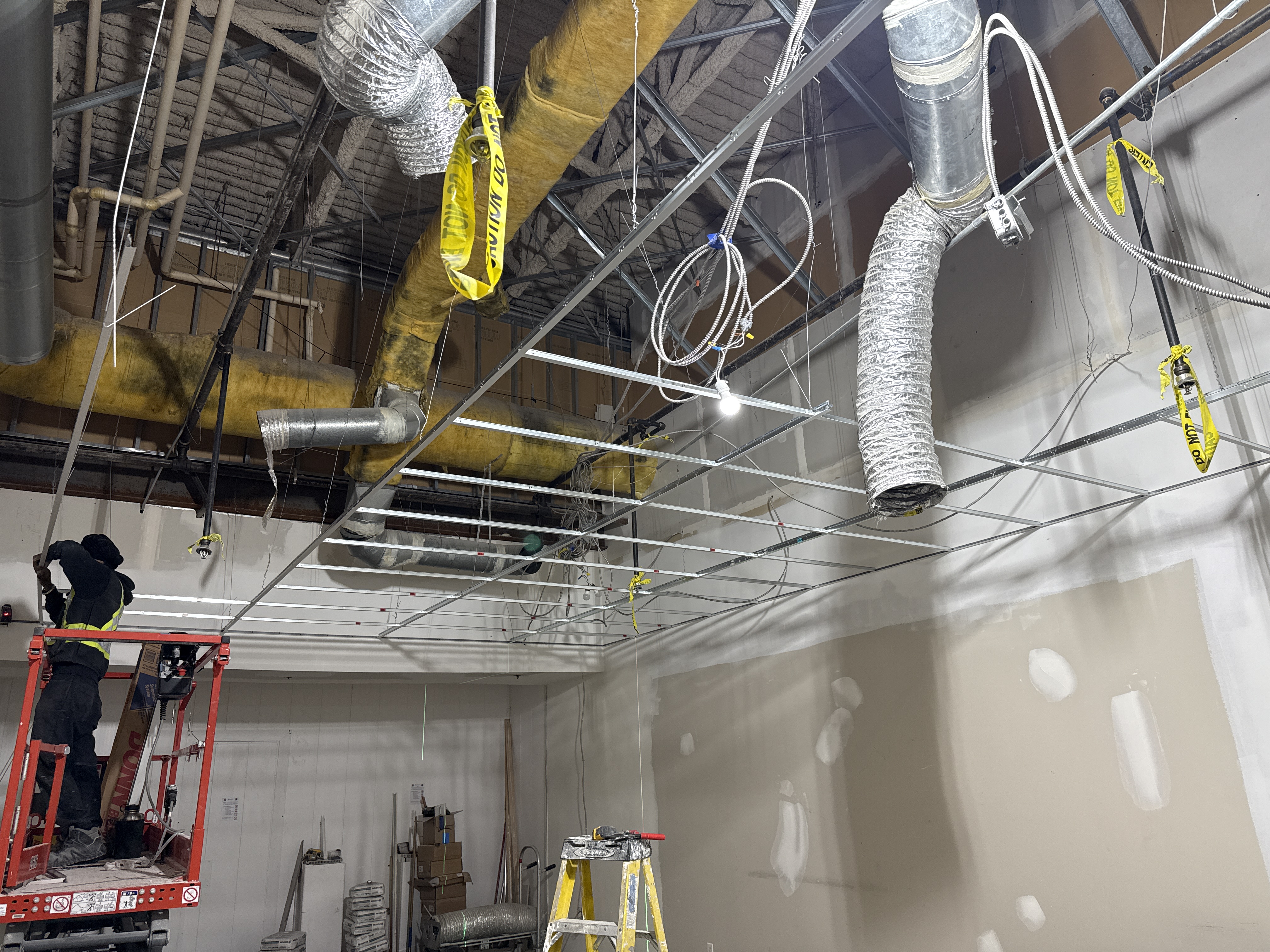 T-bar ceiling grid coordinated around ducts and building services