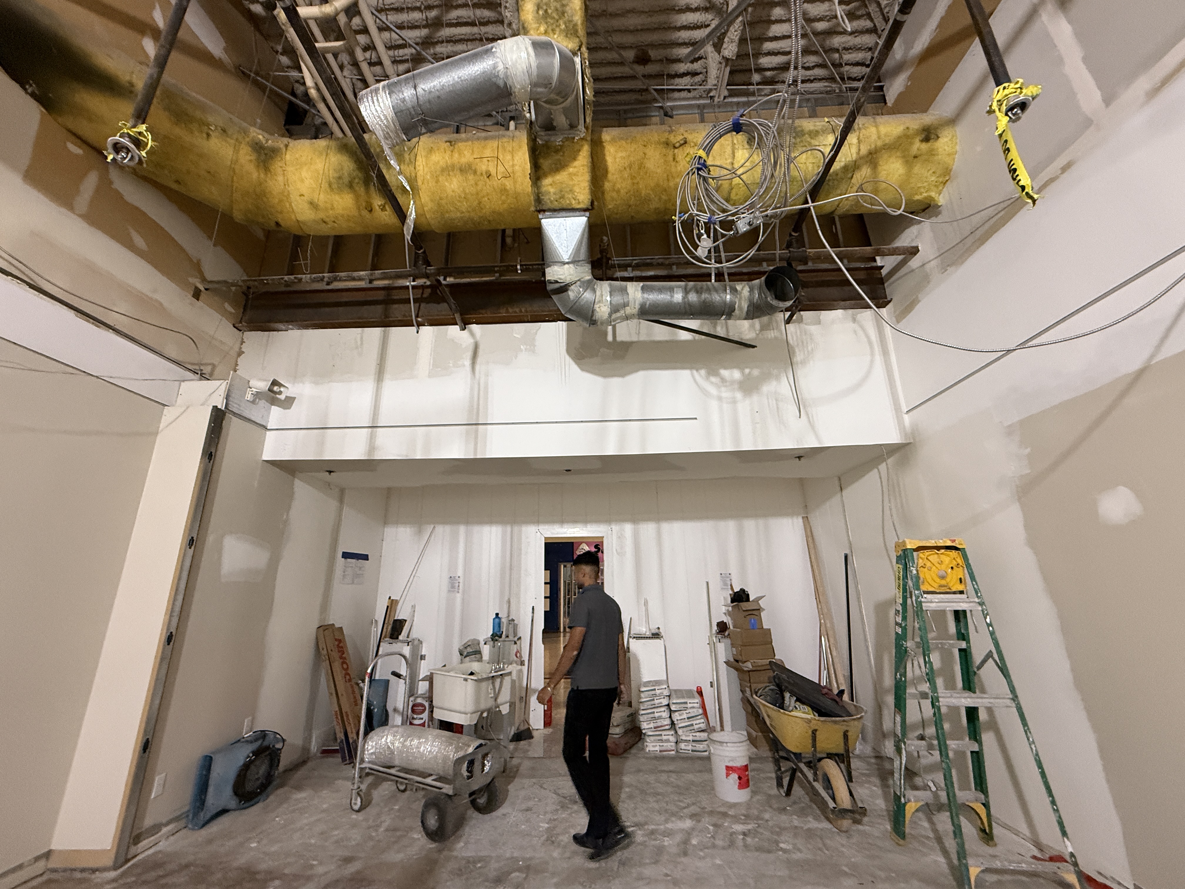 High commercial ceiling area prepared for suspended T-bar installation