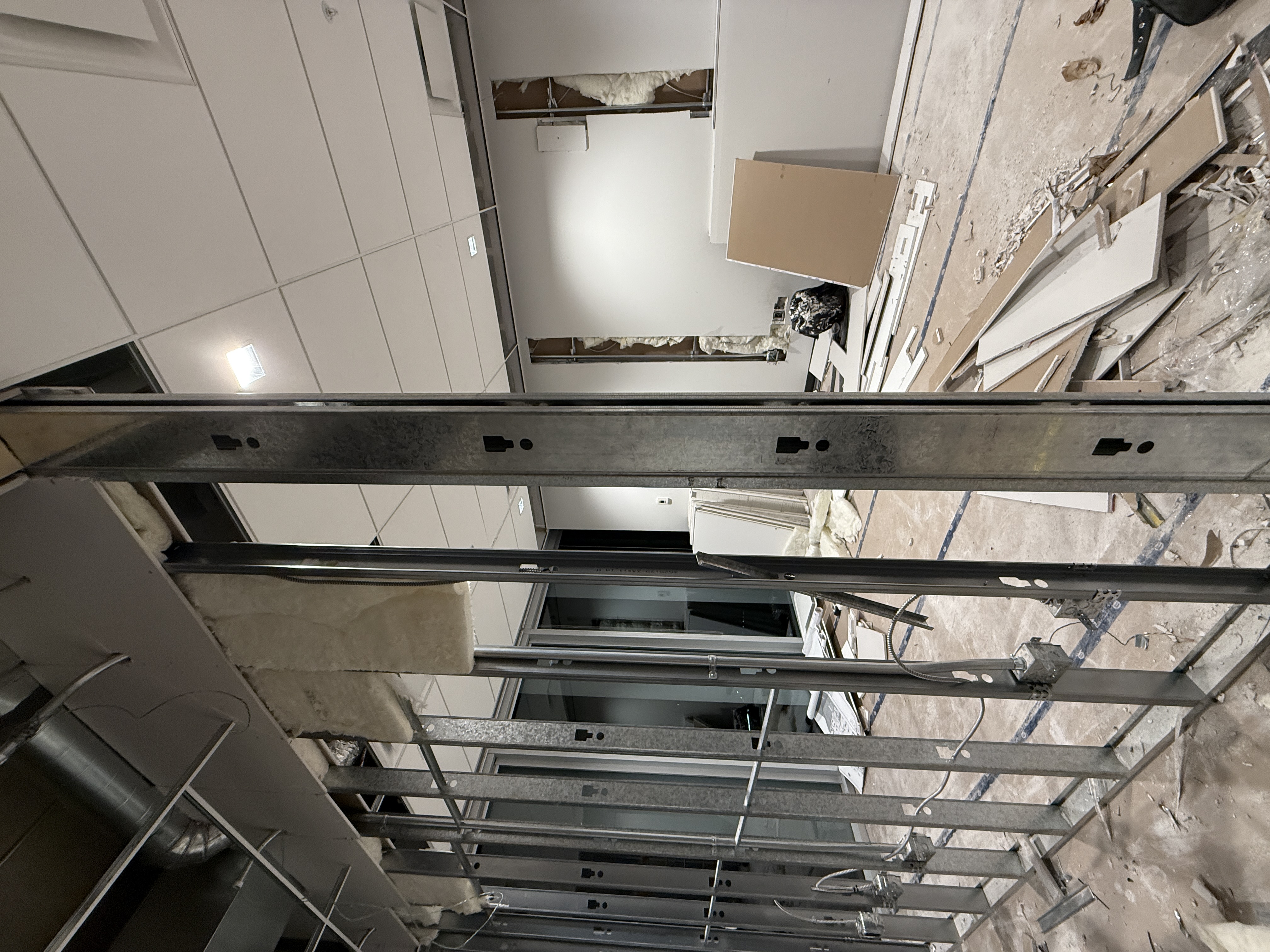 Steel-stud framing for two new rooms in a Surrey commercial building