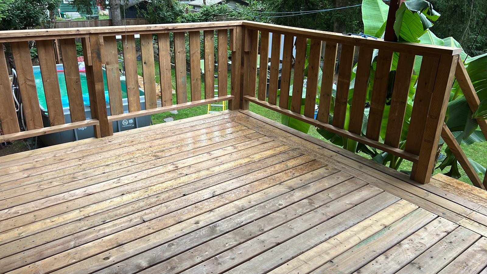Finished wood deck surface and railing