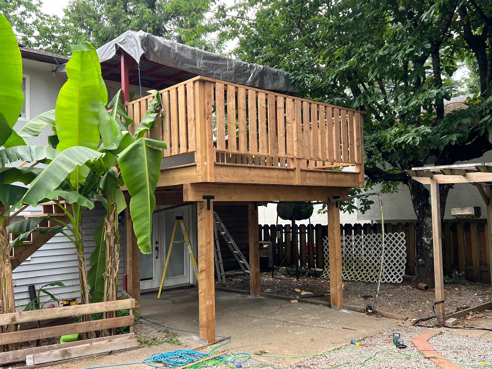 Exterior view of a raised wood deck and support posts