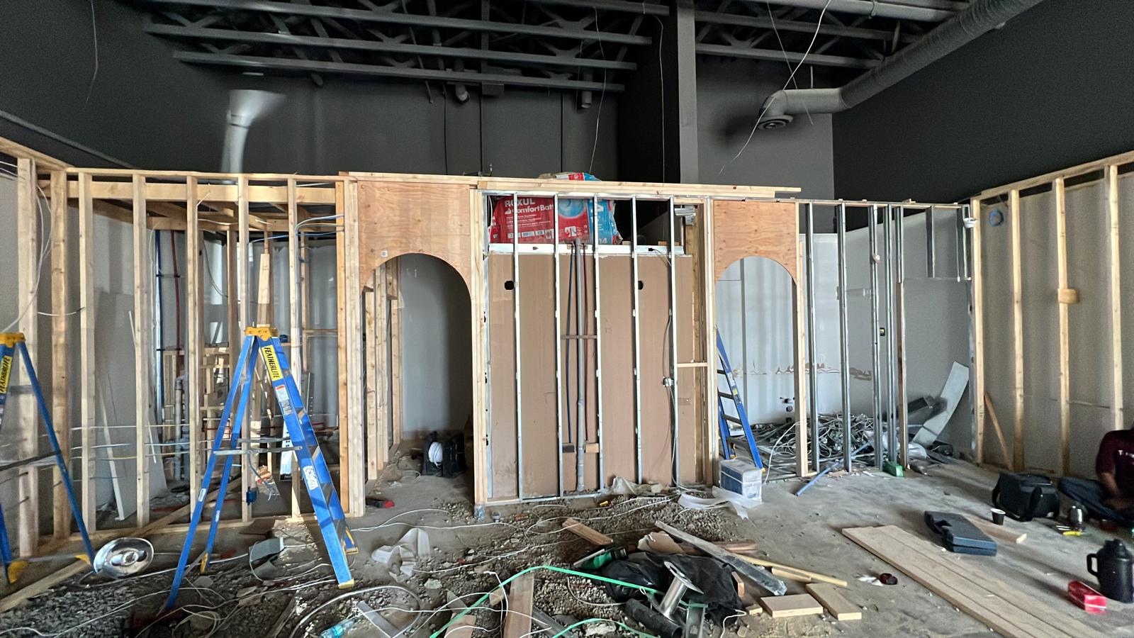 Wide view of commercial gym construction framing