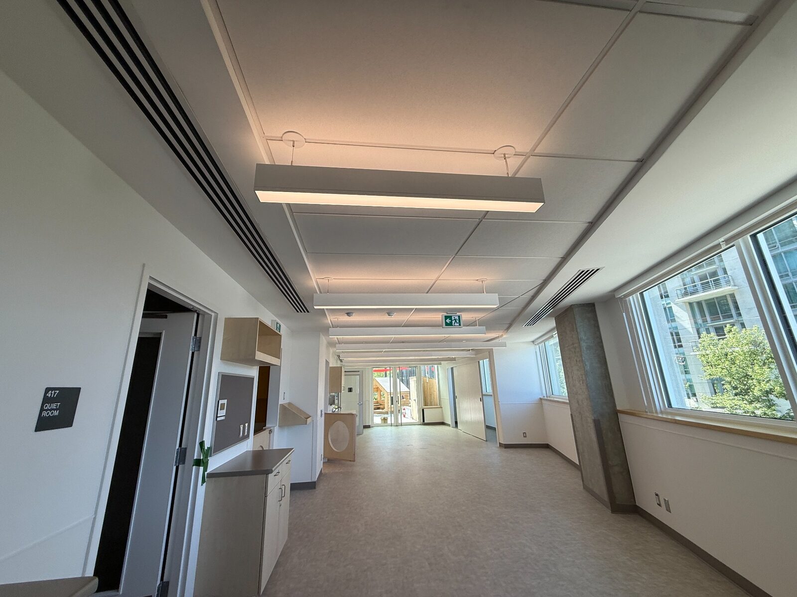 Completed Steelskin commercial interior with acoustic ceiling panels and suspended lights