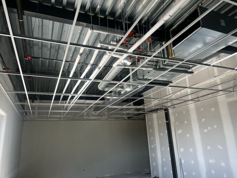 Commercial ceiling framing coordinated around mechanical and electrical services